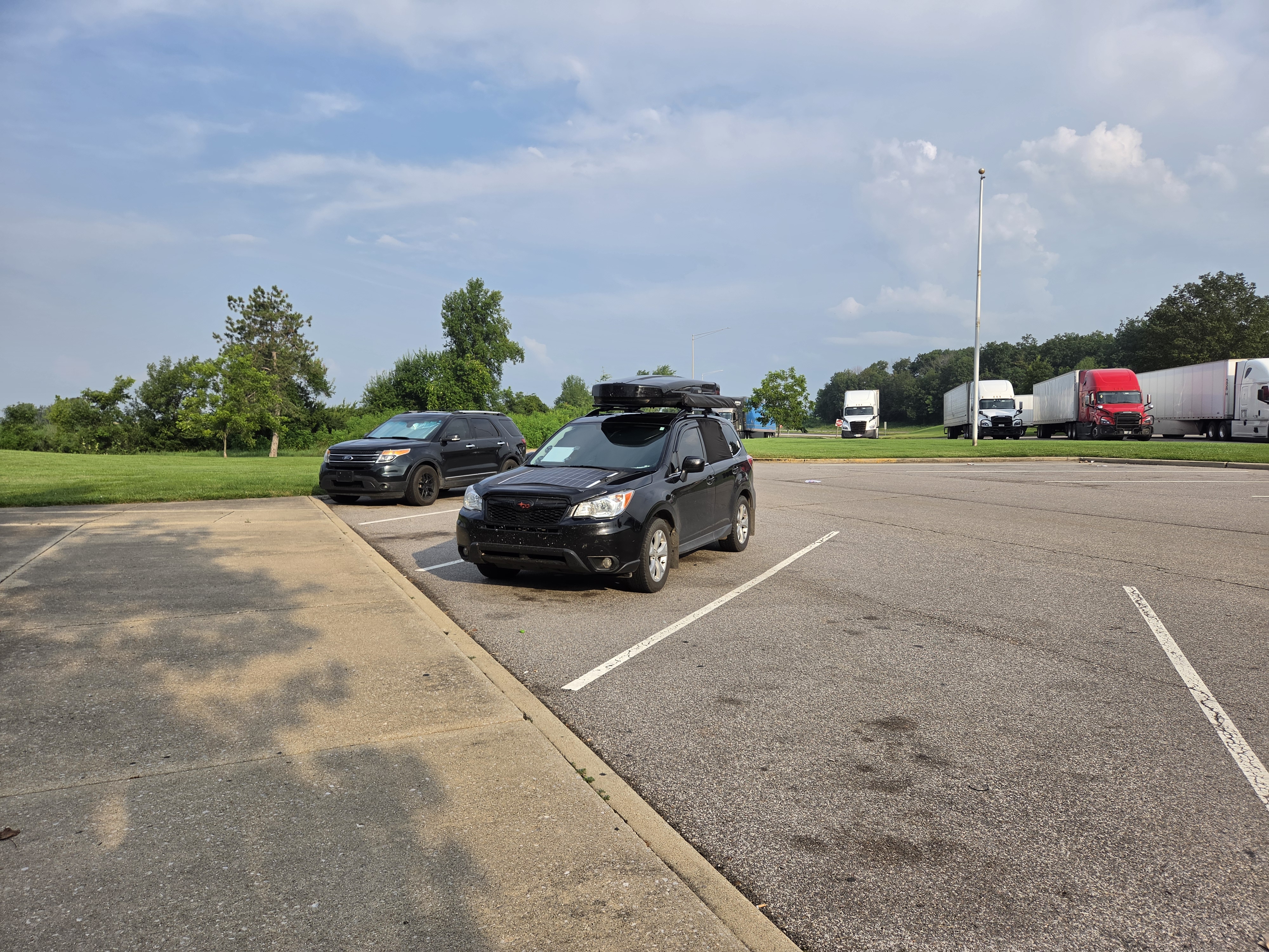 The Forester parked at a rest area in Illinois, semis lined up behind